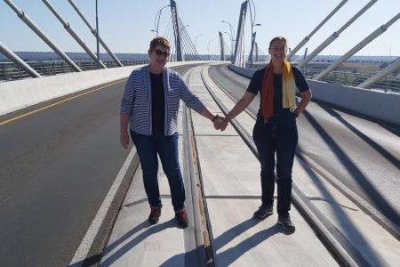 German03 SYMBOLIC HANDSHAKE The two German diplomats, Ambassadors Anne Wagner-Mitchell (right) and Hellweg Margitt-Böette pose for a photo at Kazungula Bridge. The architectural splendor was constructed to facilitate trade and promote regional integration among other things.